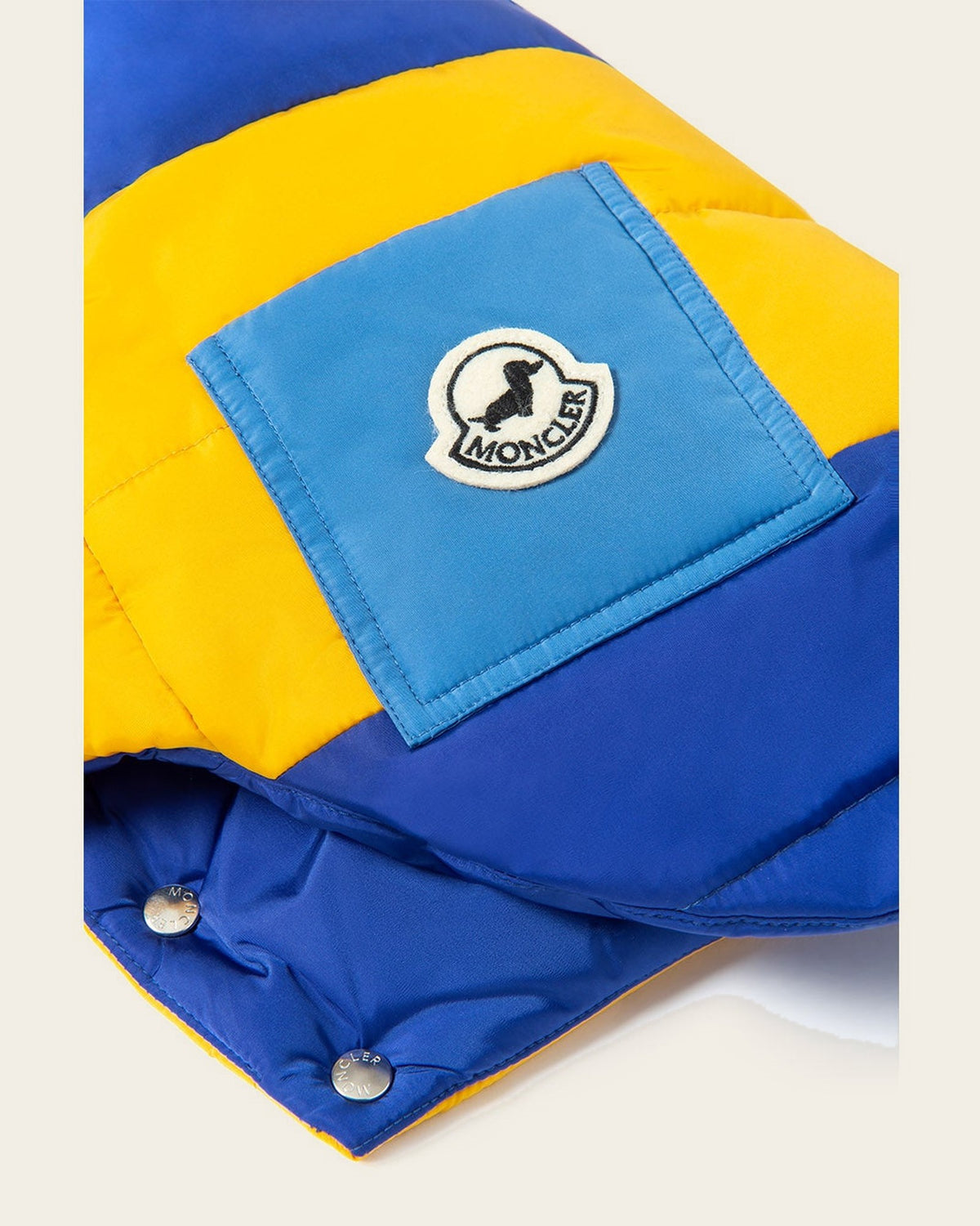 Monc x Poldo Mondog Puffer Jacket in orange & blue, detail